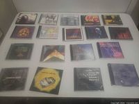 All 18 CDs laid out on table front artwork visible