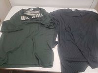 Green and black shirts laid flat