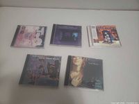 Group shot of all five CDs