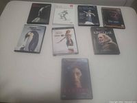 All eight DVD cases laid out on table