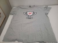 Front of gray T-shirt showing Canadian Cup logo