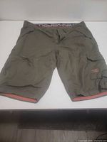 Front view of olive cargo shorts