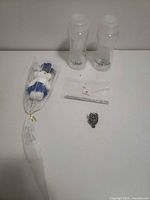 Group shot showing both water bottles, plush bear, crochet hooks in bag, owl ring