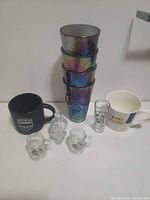 All items group view, showing tumblers stacked, mugs, bottle, shot glasses