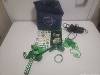 Full lot overview including tote, charger, St. Patrick’s items
