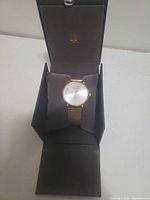 Watch displayed in open presentation box