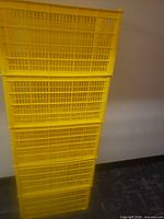 Full stack of five yellow crates