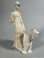 Front view of figurine showing woman and Afghan hound