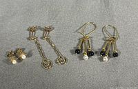 All three earring pairs laid side by side on fabric