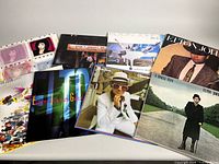 All eight album covers laid out