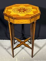 Full view of octagonal kettle stand showing overall form and legs