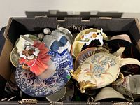 Box of assorted porcelain figurines and china pieces