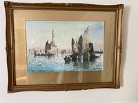 Full view of framed watercolor on wall showing painting, mat and entire frame