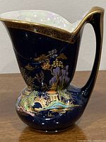 Full side view of Carlton Ware jug showing shape and decoration