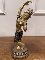 Full view of Mayadevi figure on base