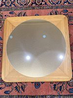 Front view showing square ash frame and round mirror