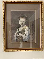 Framed engraving on wall