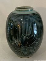 Front view showing lotus motif and vertical lines