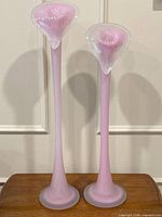 Front view of both pink opaline vases showing height and design