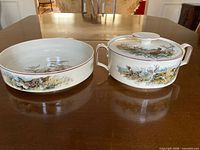 Tureen and salad dish side by side showing exterior wildlife scenes and handles
