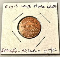 Obverse of token in cardboard flip showing NEPTUNE HOUSE ATLANTIC CITY legend and stars