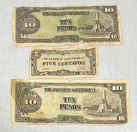 Fronts of two 10-peso notes and one 5-centavo note showing designs, serials, wear