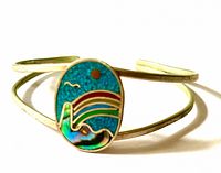 Front view of cuff bracelet showing inlay design