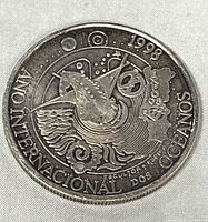 Obverse of coin showing whale design and inscriptions