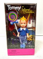 Front view of sealed box showing Tommy doll and lollipop accessory