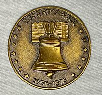 Obverse showing Liberty Bell design and star border
