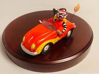 Three-quarter view of ornament on round base