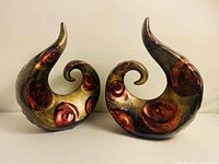 front view of both spiral ceramic sculptures