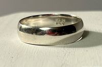 Sterling silver band ring angled view showing exterior surface