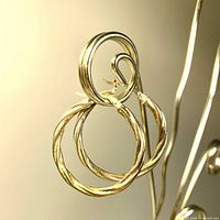 close view of twisted hoop design hanging on stand