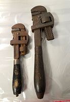 Front view of both wrenches showing overall form and wood handles