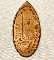 Front of elongated penny showing design and inscription