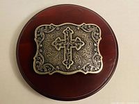 Front view showing cross motif and scalloped frame