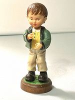 Front view of Anri wood carved Conductor figurine