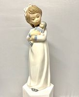 Front view of full figurine on stand