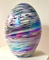 Front view of iridescent swirl glass egg