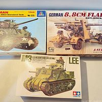 Overview of all three model kit boxes