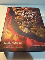Front of Greystones Jacobite Highlander box showing artwork and product title