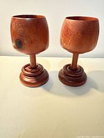 Pair of turned wood goblets showing full shape and color