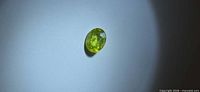 Front view of oval chartreuse sphene