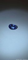 Top view of oval Tanzanite on neutral background