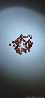 Loose square garnets grouped on background, showing overall quantity