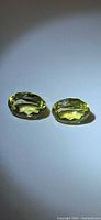 Pair of oval lemon citrines under direct light