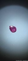 Loose pear cut pink sapphire on neutral background