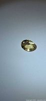 Top view of oval yellow beryl gemstone