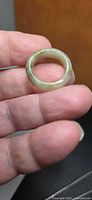 Side view of jade band ring showing color and translucency
